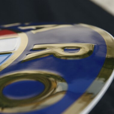 Alfa Romeo porcelain enamel sign, detailed view of the embossing featuring real gold 